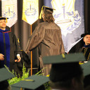 President Robert Mayes congratulates a 2013 graduate.