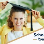 woman smiling with a graduation mortar board